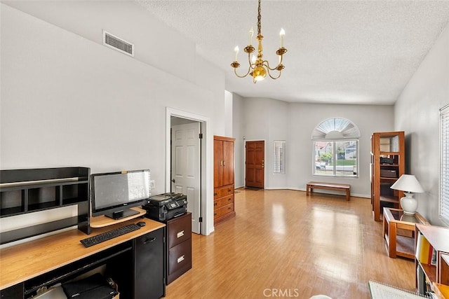 19080 Shakespeare Dr, Walnut, CA 91789 - home office with a textured ceiling, a chandelier, and light wood-style flooring