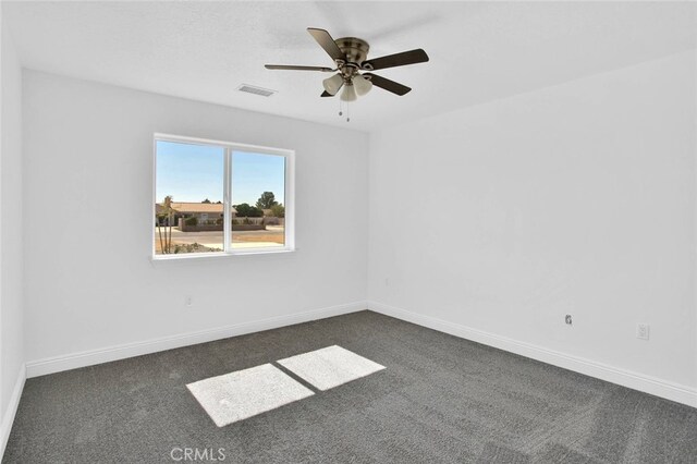 10533 Mohawk Rd, Apple Valley, CA 92308 - spare room featuring dark colored carpet and a ceiling fan