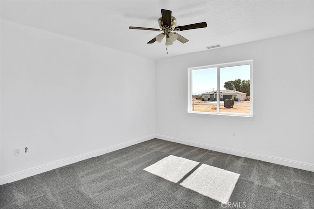 10533 Mohawk Rd, Apple Valley, CA 92308 - empty room featuring dark carpet and ceiling fan