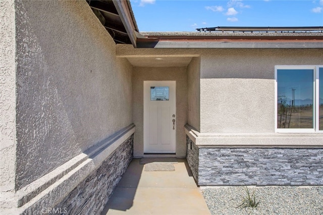 10533 Mohawk Rd, Apple Valley, CA 92308 - view of exterior entry with stucco siding and stone siding