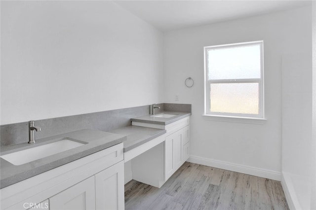 10533 Mohawk Rd, Apple Valley, CA 92308 - full bath with vanity and wood finished floors