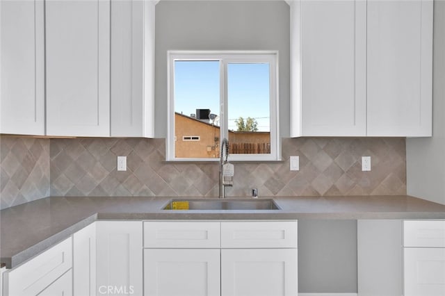 10533 Mohawk Rd, Apple Valley, CA 92308 - kitchen with white cabinets and backsplash