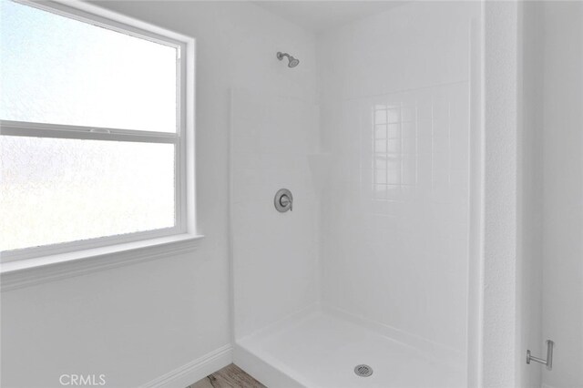 10533 Mohawk Rd, Apple Valley, CA 92308 - bathroom featuring a shower and baseboards