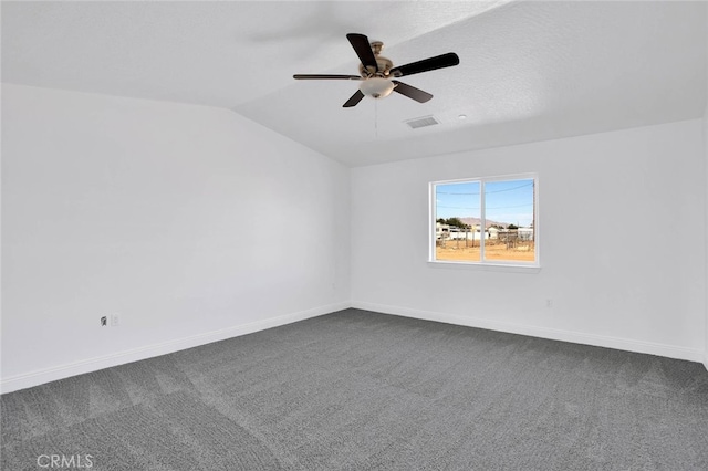 10533 Mohawk Rd, Apple Valley, CA 92308 - unfurnished room with vaulted ceiling, dark colored carpet, and ceiling fan
