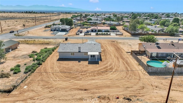 10533 Mohawk Rd, Apple Valley, CA 92308 - aerial perspective of suburban area featuring a mountainous background and a pool area