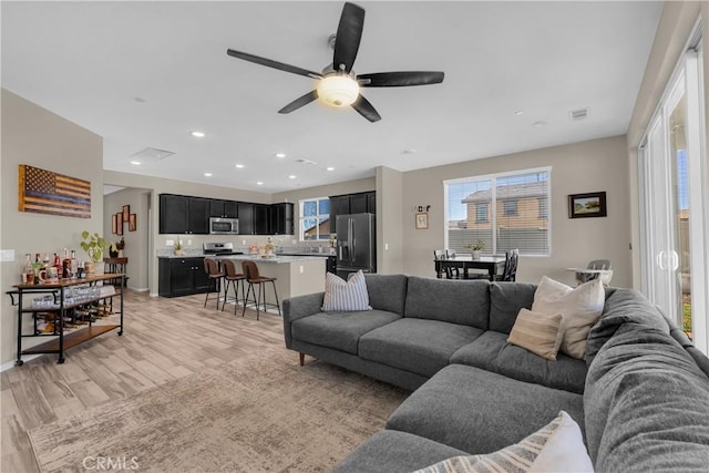 1511 Asteroid Way, Beaumont, CA 92223 - living area featuring light wood-style floors, ceiling fan, and recessed lighting