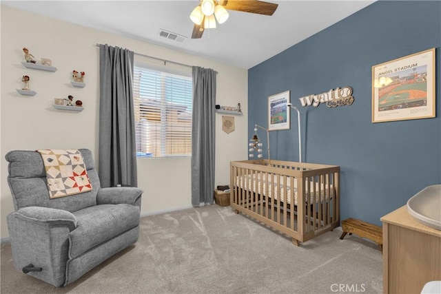1511 Asteroid Way, Beaumont, CA 92223 - bedroom featuring carpet flooring, a nursery area, and a ceiling fan