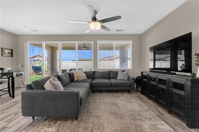 1511 Asteroid Way, Beaumont, CA 92223 - living area featuring light wood-style flooring and a ceiling fan