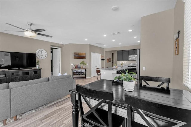 1511 Asteroid Way, Beaumont, CA 92223 - dining room featuring ceiling fan, light wood-type flooring, and recessed lighting