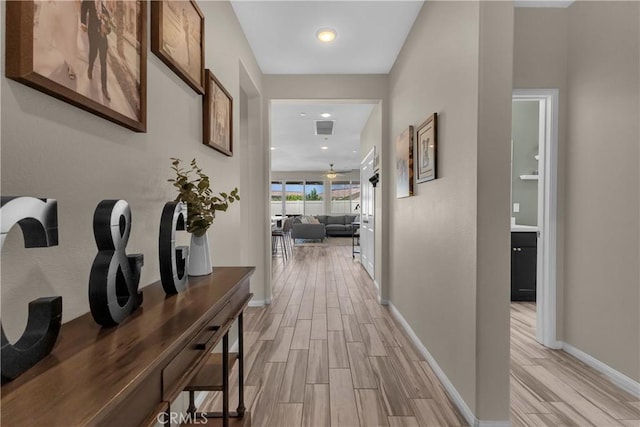 1511 Asteroid Way, Beaumont, CA 92223 - corridor with light wood-style floors and baseboards