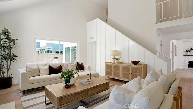 3073 N Pinewood St, Orange, CA 92865 - living area with a towering ceiling, light wood finished floors, and stairs
