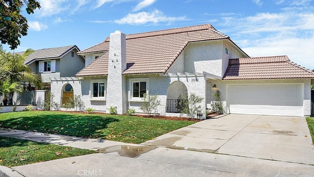 3073 N Pinewood St, Orange, CA 92865 - view of front facade featuring a tiled roof, an attached garage, concrete driveway, and stucco siding
