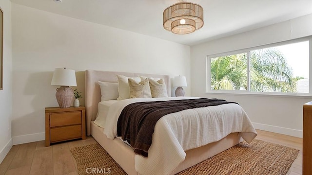 3073 N Pinewood St, Orange, CA 92865 - bedroom with baseboards and light wood-style flooring