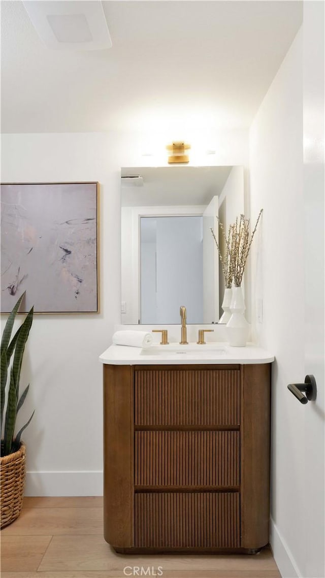 3073 N Pinewood St, Orange, CA 92865 - bathroom with vanity and wood finished floors