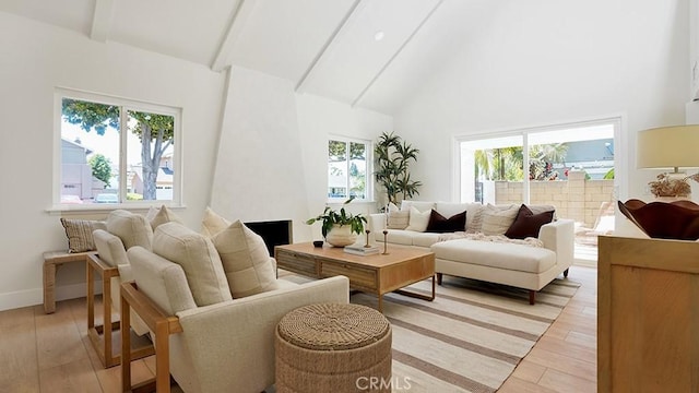 3073 N Pinewood St, Orange, CA 92865 - living room featuring light wood-style floors, beam ceiling, and high vaulted ceiling