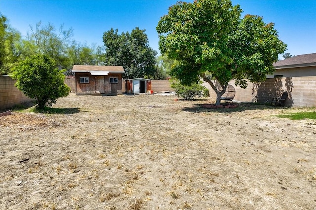 18934 San Bernardino Ave, Bloomington, CA 92316 - fenced backyard with a storage unit