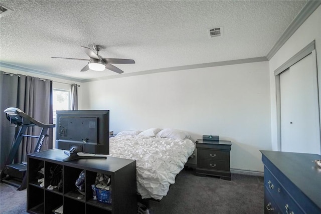 18934 San Bernardino Ave, Bloomington, CA 92316 - bedroom featuring ornamental molding, dark carpet, a textured ceiling, a ceiling fan, and a closet