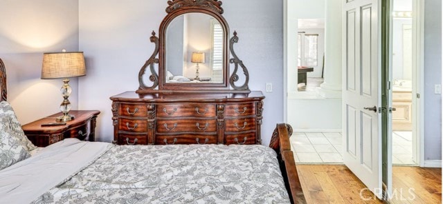 1020 La Salle Cir, Corona, CA 92879 - bedroom featuring wood finished floors and connected bathroom