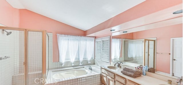 1020 La Salle Cir, Corona, CA 92879 - full bath with lofted ceiling, a garden tub, double vanity, a stall shower, and plenty of natural light