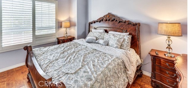 1020 La Salle Cir, Corona, CA 92879 - bedroom with baseboards and wood finished floors