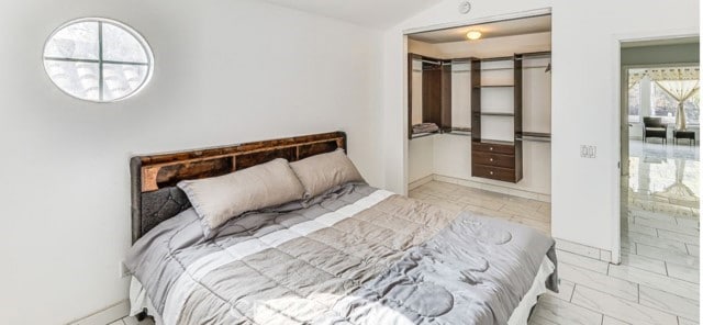 1020 La Salle Cir, Corona, CA 92879 - bedroom featuring multiple windows, vaulted ceiling, and a closet
