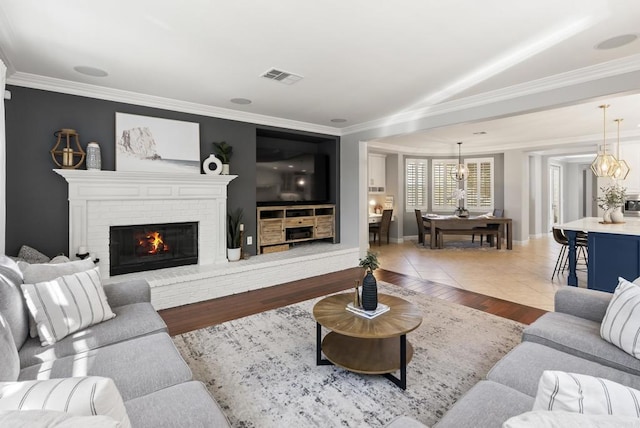 6257 Alverton, Carlsbad, CA 92009 - living area with ornamental molding, a fireplace, and wood finished floors