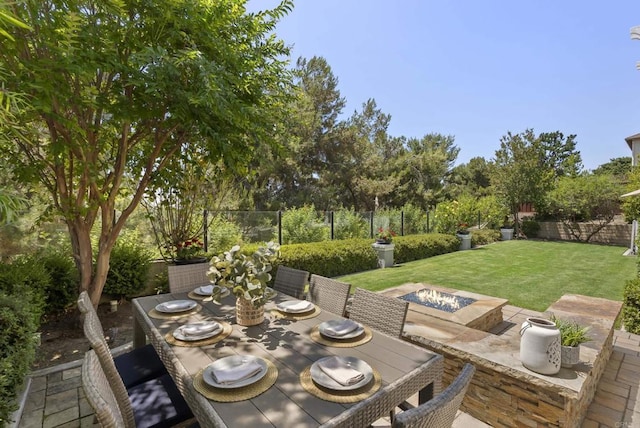 6257 Alverton, Carlsbad, CA 92009 - fenced backyard featuring an outdoor fire pit, outdoor dining space, and a patio area