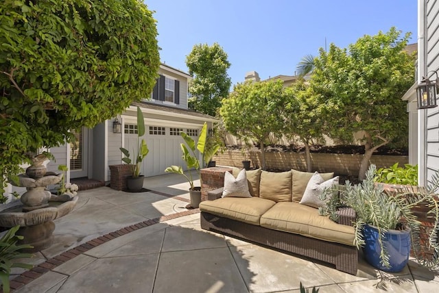 6257 Alverton, Carlsbad, CA 92009 - view of patio with outdoor lounge area, a garage, and concrete driveway