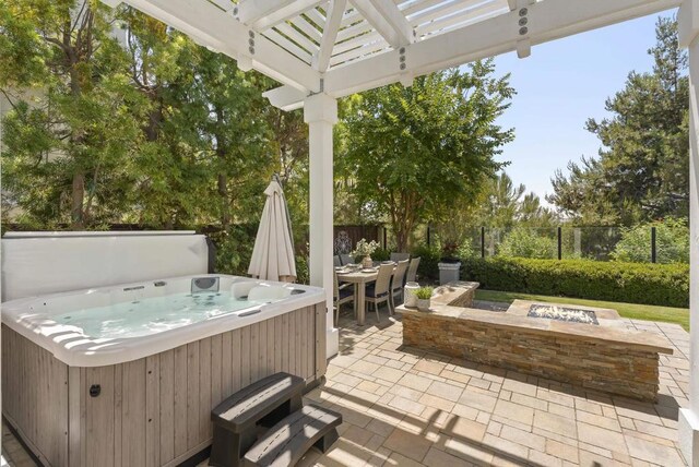 6257 Alverton, Carlsbad, CA 92009 - view of patio featuring a hot tub, an outdoor fire pit, a pergola, and outdoor dining area