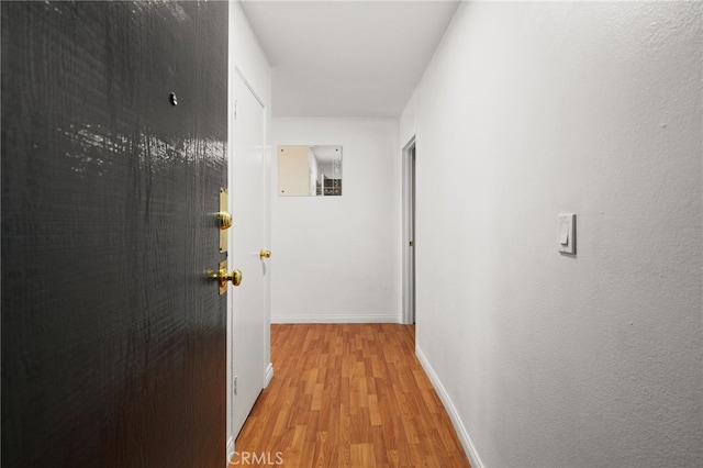 911 N Kings Rd Unit 310, West Hollywood, CA 90069 - corridor featuring light wood-style flooring and baseboards
