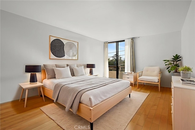 911 N Kings Rd Unit 310, West Hollywood, CA 90069 - bedroom featuring light wood-style flooring