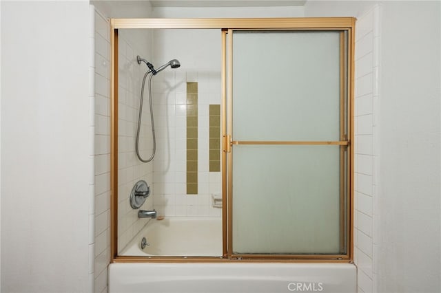 911 N Kings Rd Unit 310, West Hollywood, CA 90069 - bathroom featuring combined bath / shower with glass door