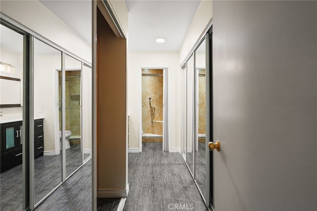 911 N Kings Rd Unit 310, West Hollywood, CA 90069 - corridor featuring dark wood-style floors and baseboards