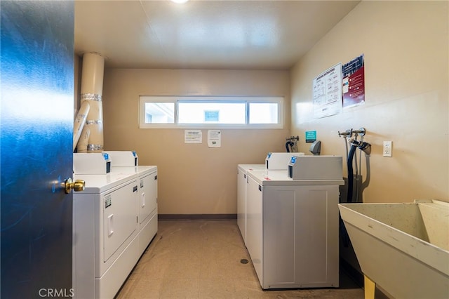 911 N Kings Rd Unit 310, West Hollywood, CA 90069 - communal laundry room featuring separate washer and dryer