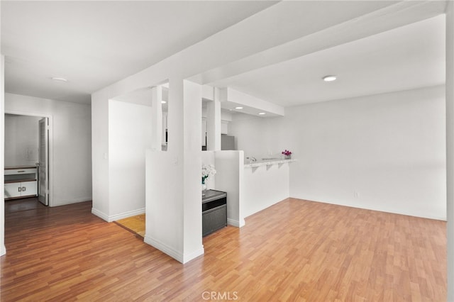 911 N Kings Rd Unit 310, West Hollywood, CA 90069 - below grade area featuring light wood-type flooring and recessed lighting
