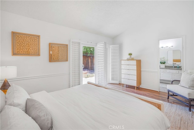 5022 Tamarack Way, Irvine, CA 92612 - bedroom with vaulted ceiling, wood finished floors, and ensuite bathroom