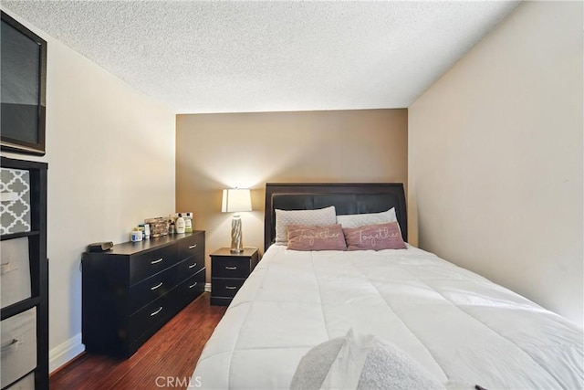 1459 Fredericks Ln, Upland, CA 91786 - bedroom with dark wood finished floors and a textured ceiling
