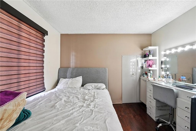 1459 Fredericks Ln, Upland, CA 91786 - bedroom featuring dark wood finished floors, a textured ceiling, and an office area