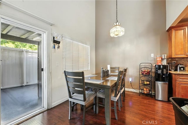 1459 Fredericks Ln, Upland, CA 91786 - dining space with a high ceiling, dark wood finished floors, and a chandelier