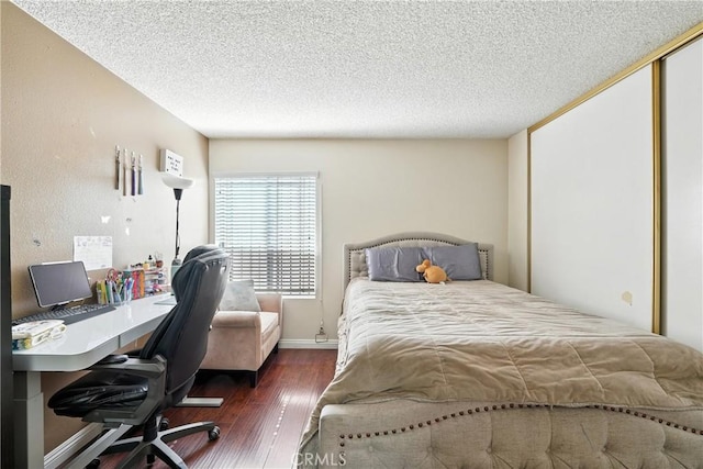 1459 Fredericks Ln, Upland, CA 91786 - bedroom with wood finished floors, a desk, a textured ceiling, and a closet