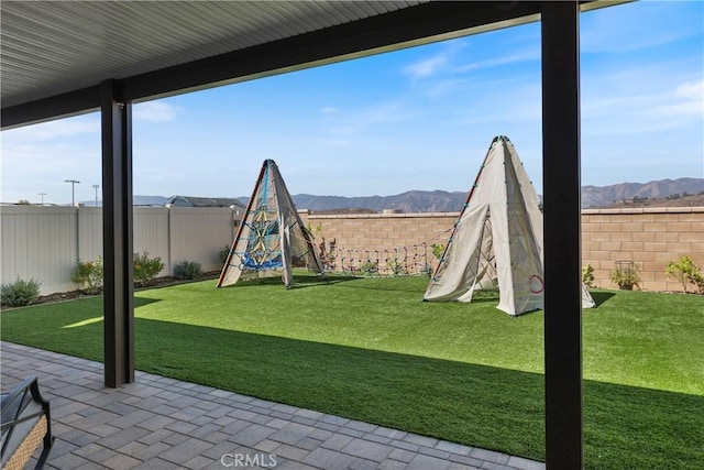 19465 Brush Creek Way, Lake Elsinore, CA 92532 - fenced backyard with a patio area and a mountain view