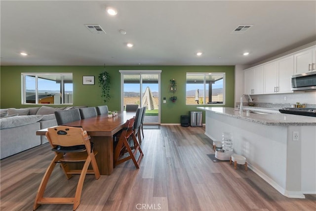 19465 Brush Creek Way, Lake Elsinore, CA 92532 - dining space with light wood-type flooring and recessed lighting