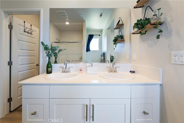 19465 Brush Creek Way, Lake Elsinore, CA 92532 - full bathroom featuring double vanity and a stall shower