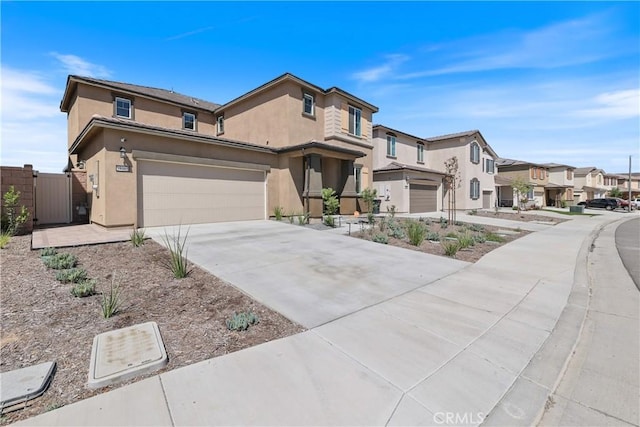 19465 Brush Creek Way, Lake Elsinore, CA 92532 - view of front of house featuring a residential view, driveway, stucco siding, an attached garage, and a gate