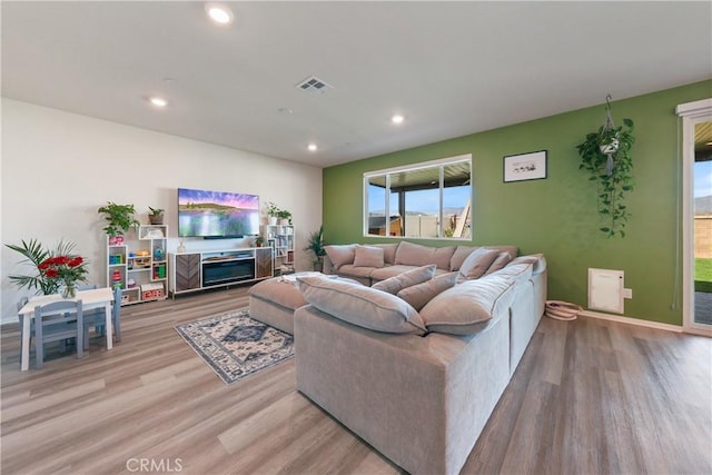 19465 Brush Creek Way, Lake Elsinore, CA 92532 - living room featuring wood finished floors and recessed lighting