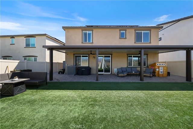 19465 Brush Creek Way, Lake Elsinore, CA 92532 - rear view of property with an outdoor living space with a fire pit, roof mounted solar panels, a patio, and stucco siding