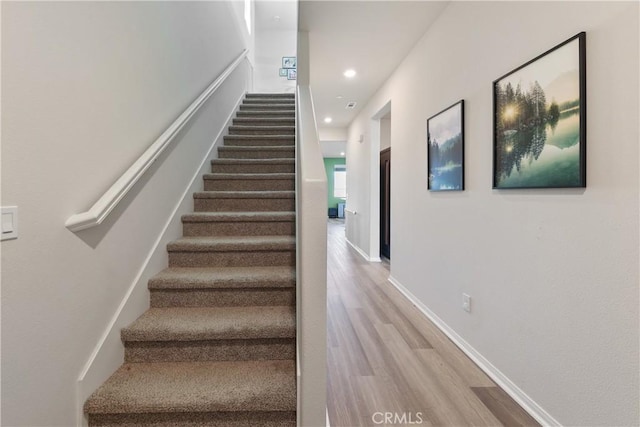 19465 Brush Creek Way, Lake Elsinore, CA 92532 - stairway with wood finished floors and recessed lighting