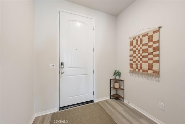19465 Brush Creek Way, Lake Elsinore, CA 92532 - doorway to outside featuring wood finished floors