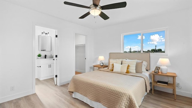 5122 Coban St, San Diego, CA 92114 - bedroom featuring light wood-type flooring, a spacious closet, ensuite bath, a closet, and ceiling fan