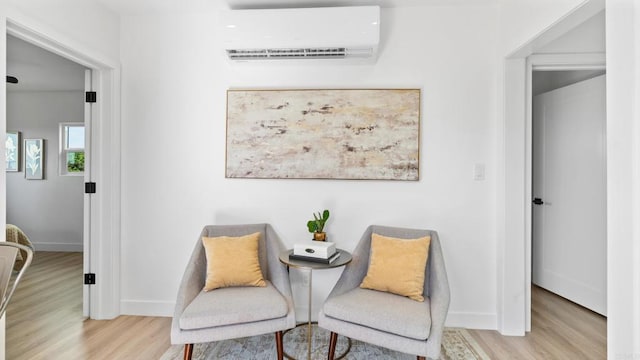 5122 Coban St, San Diego, CA 92114 - living area featuring a wall mounted AC and wood finished floors